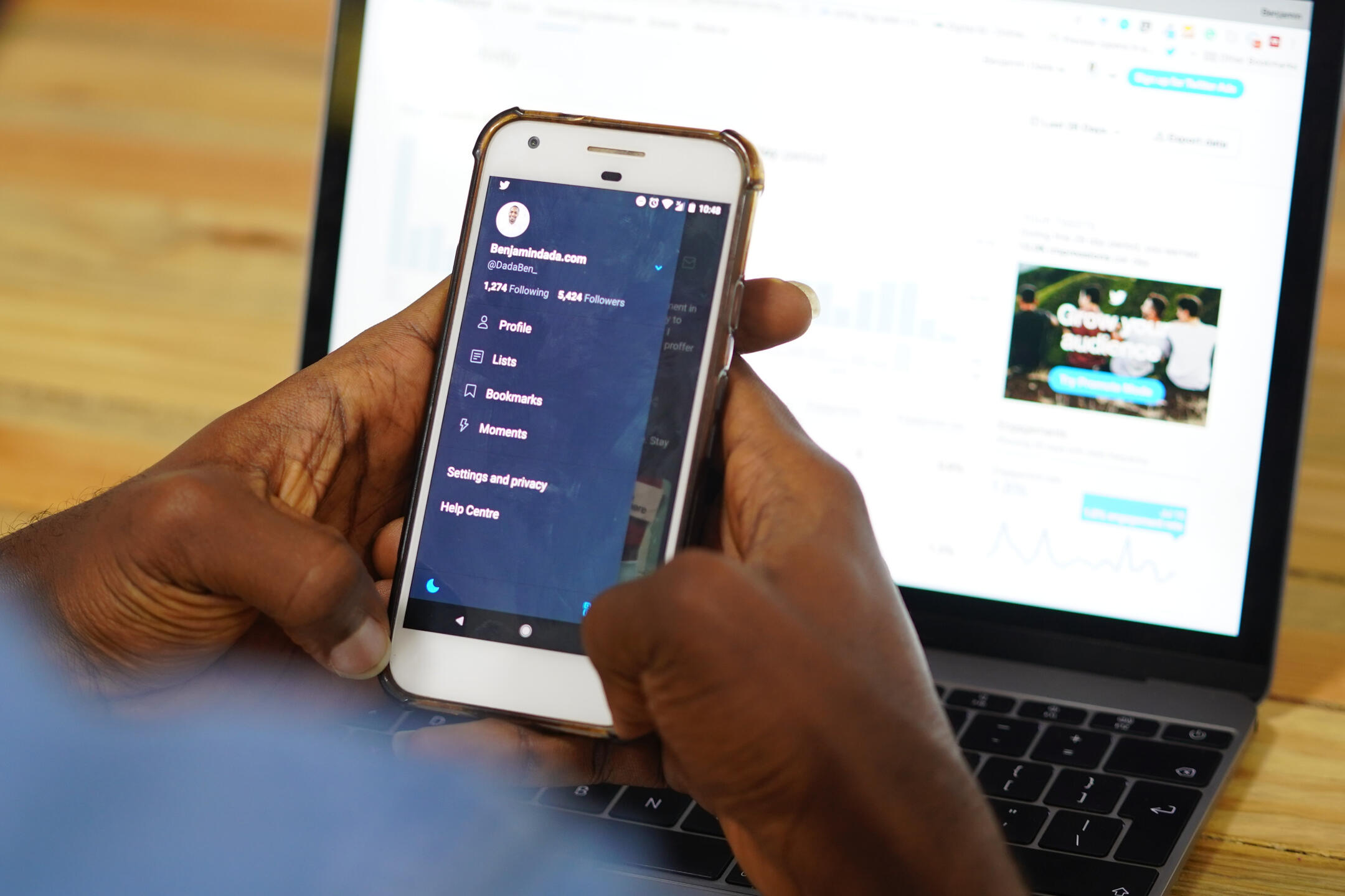 Photo of a person looking at their Twitter profile by Benjamin Dada on Unsplash
